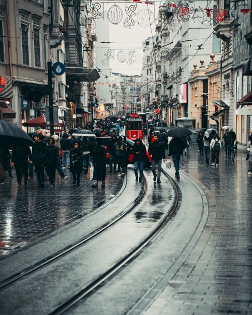 Free Crowded İstiklal Avenue in İstanbul on a rainy day with people walking and iconic tram. Stock Photo