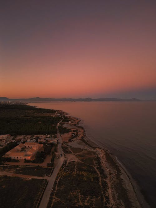 Aerial View of a Coastline at Sunset