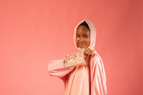 Portrait of Woman Wearing Traditional Pink Headscarf