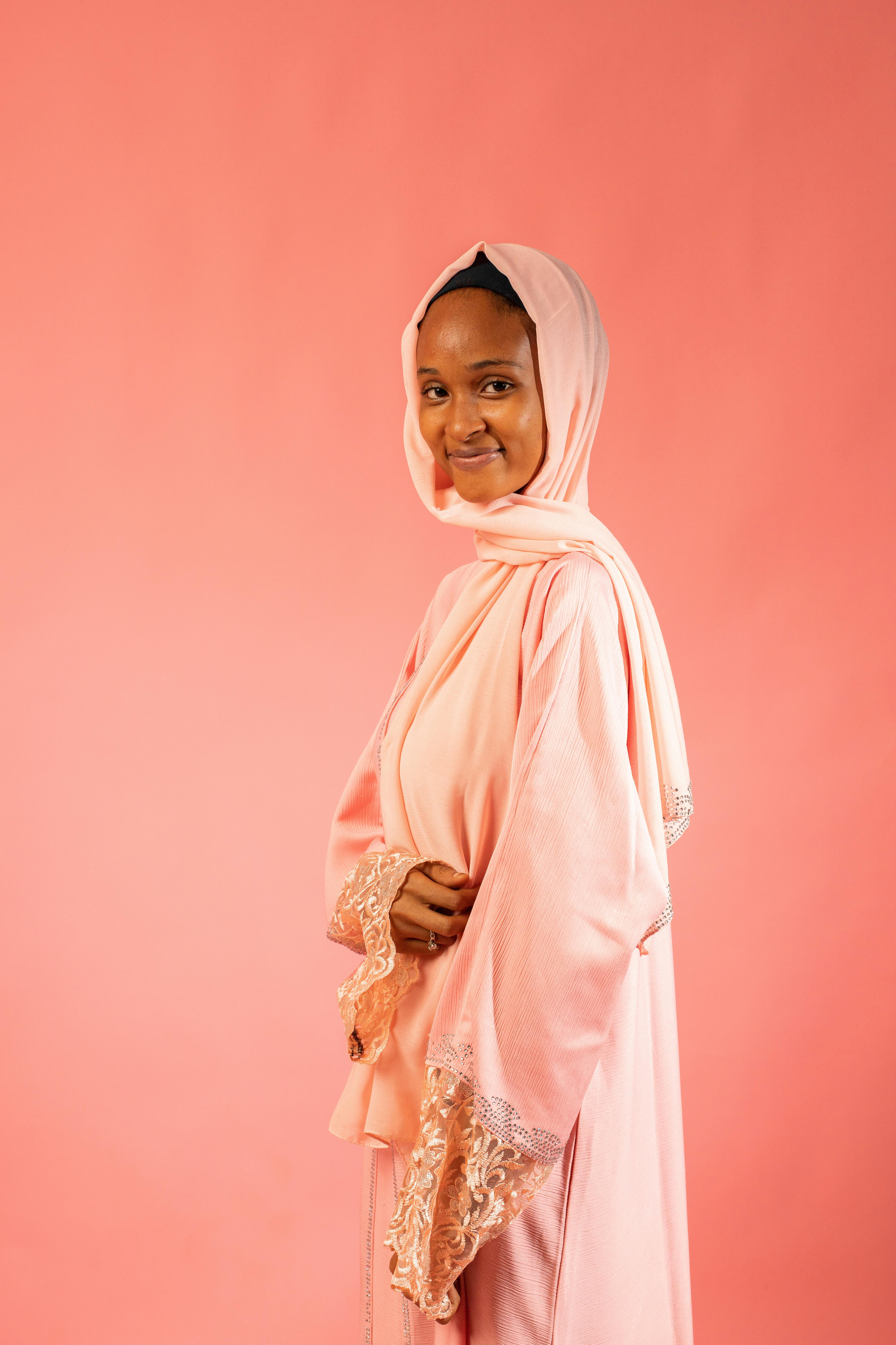 Confident woman leading a team, showcasing modest leadership