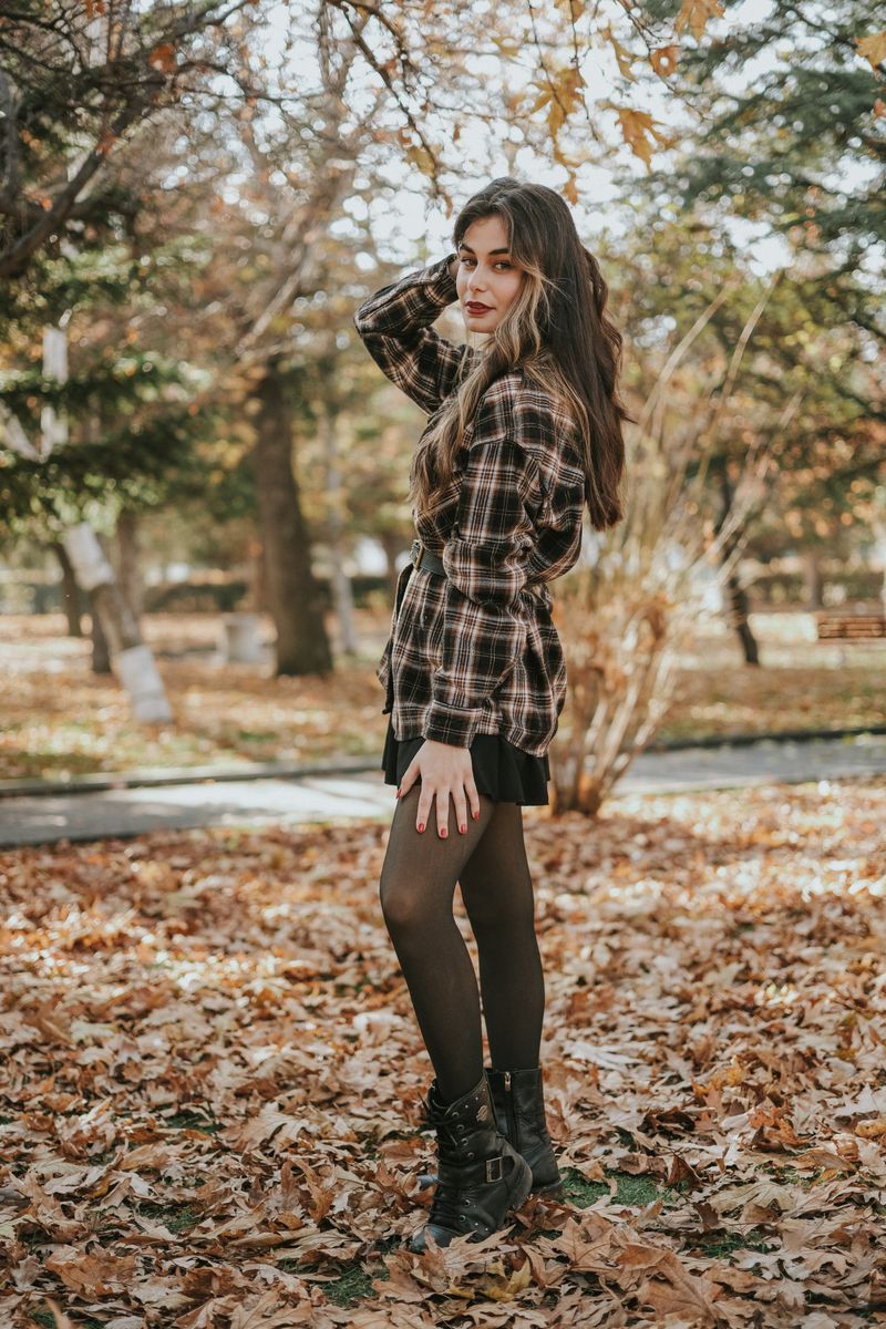 Woman in plaid skirt with tights