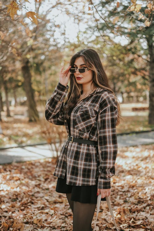 Woman in Sunglasses in Park in Autumn