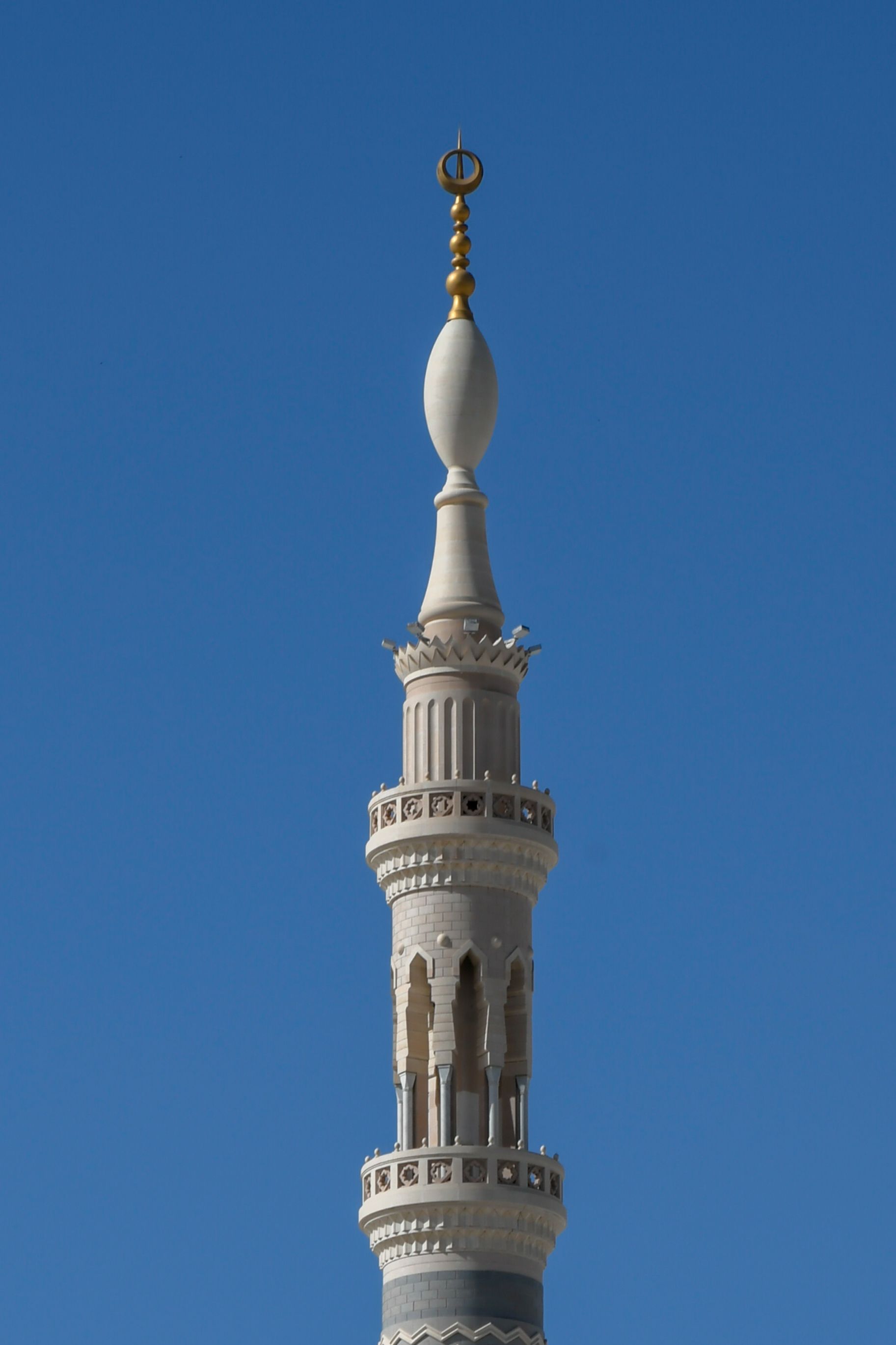 Close-up of a minaret at Al Masjid an Nabawi in Madinah, showcasing Islamic architectural detail.