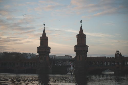 Silhouetted Oberbaum Bridge Crossing the River Spree in Berlin, Germany 