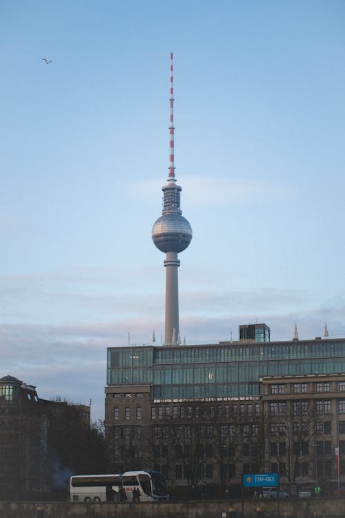 View of the Berliner Fernsehturm behind a Building in Berlin, Germany 