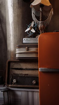 Charming vintage scene featuring retro appliances, a classic lamp, and antique radio in an old room.