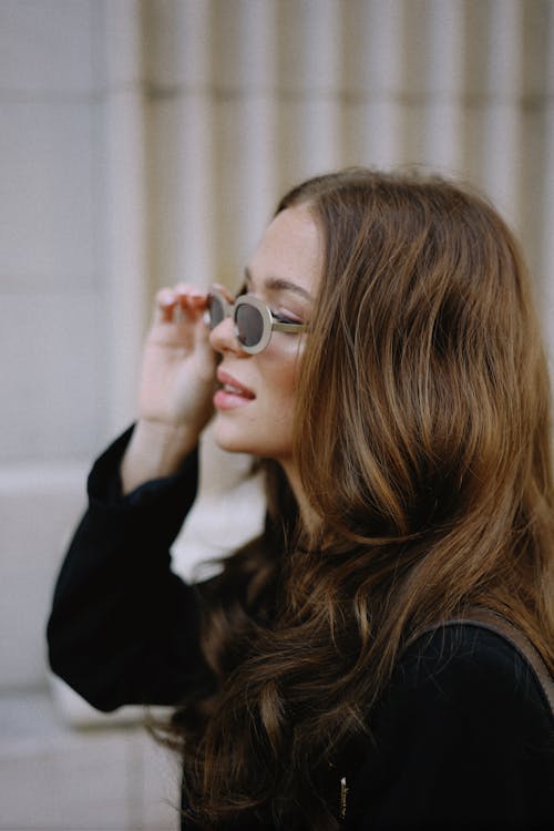 Woman Fixing her Sunglasses