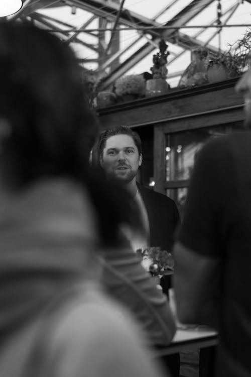 Black and White Shot of a Man in a Store 