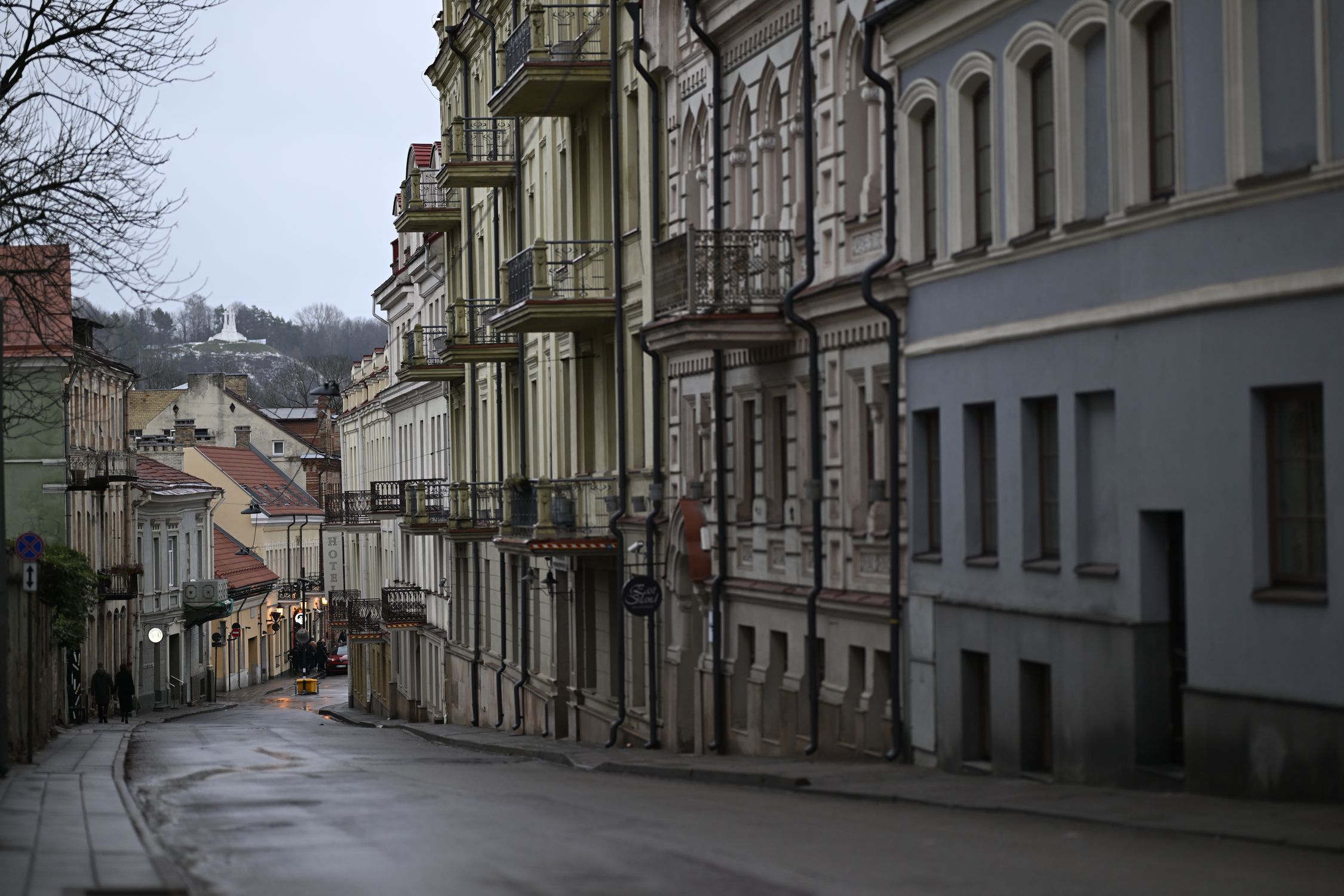 Elegant street view of historical townhouses in Vilnius' Old Town, Lithuania.