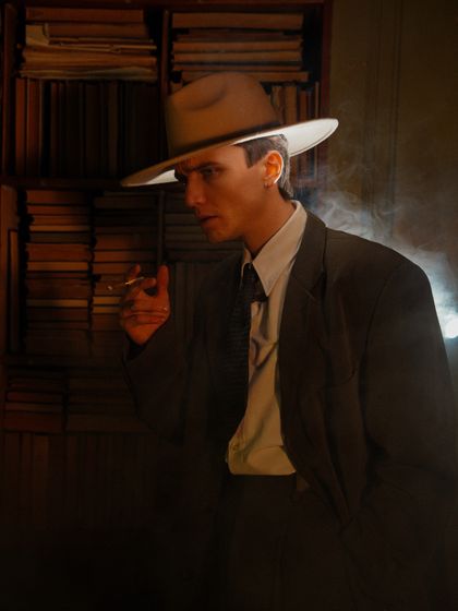 Noir portrait in suit and hat by Nadin Sh on Pexels