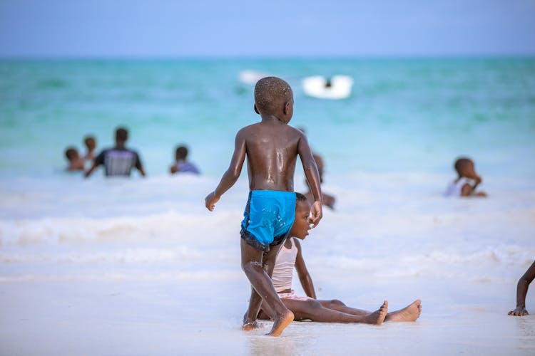 Kids Playing On Beach