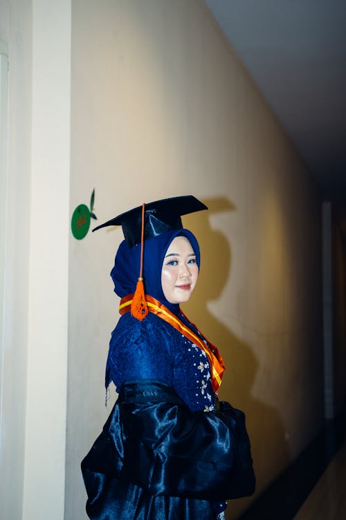 Woman Wearing a Mortarboard and a Gown 