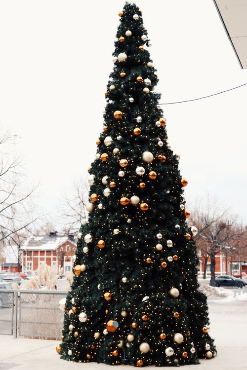 Free Decorated Christmas tree on a city street in Jönköping, Sweden, capturing festive spirit. Stock Photo