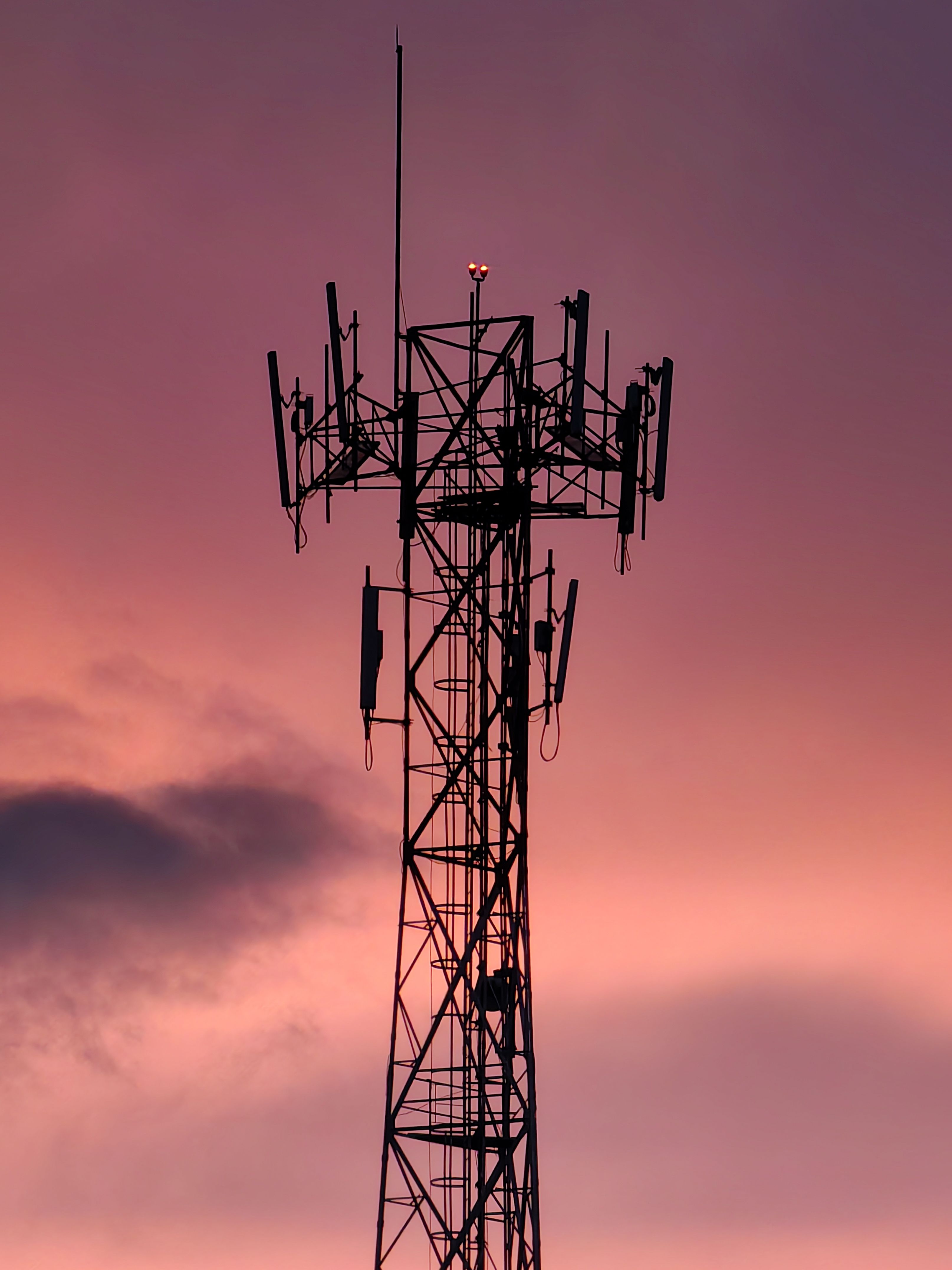 Silhouetted Telecommunications Tower against a Pink Sunset Sky · Free ...