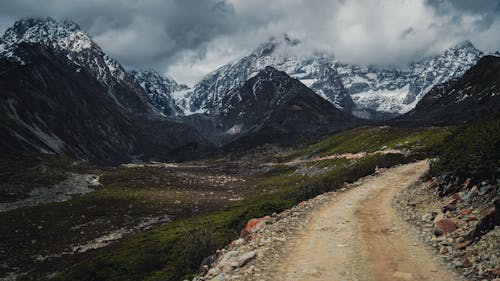 View of a Train in Rocky, Snowcapped Mountains 