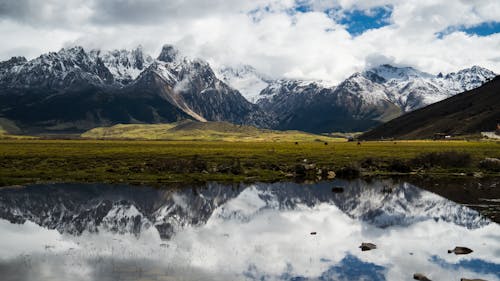 Snowcapped Mountains Reflected in a Lake 