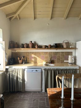 Cozy vintage kitchen interior featuring rustic elements and natural lighting.