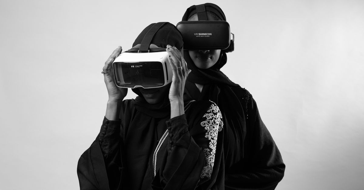 Women in Traditional Clothing Wearing VR Headsets · Free Stock Photo