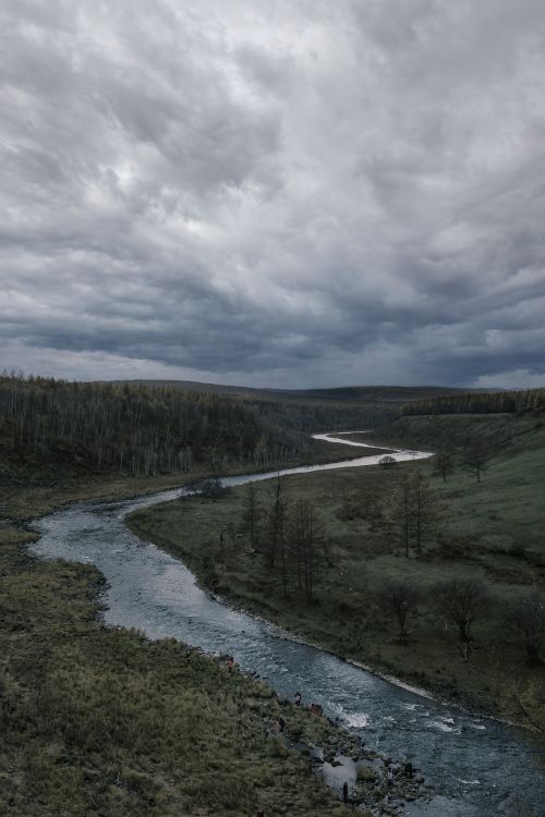 With Rivers Raring Below River under Cloudy Sky · Free Stock Photo