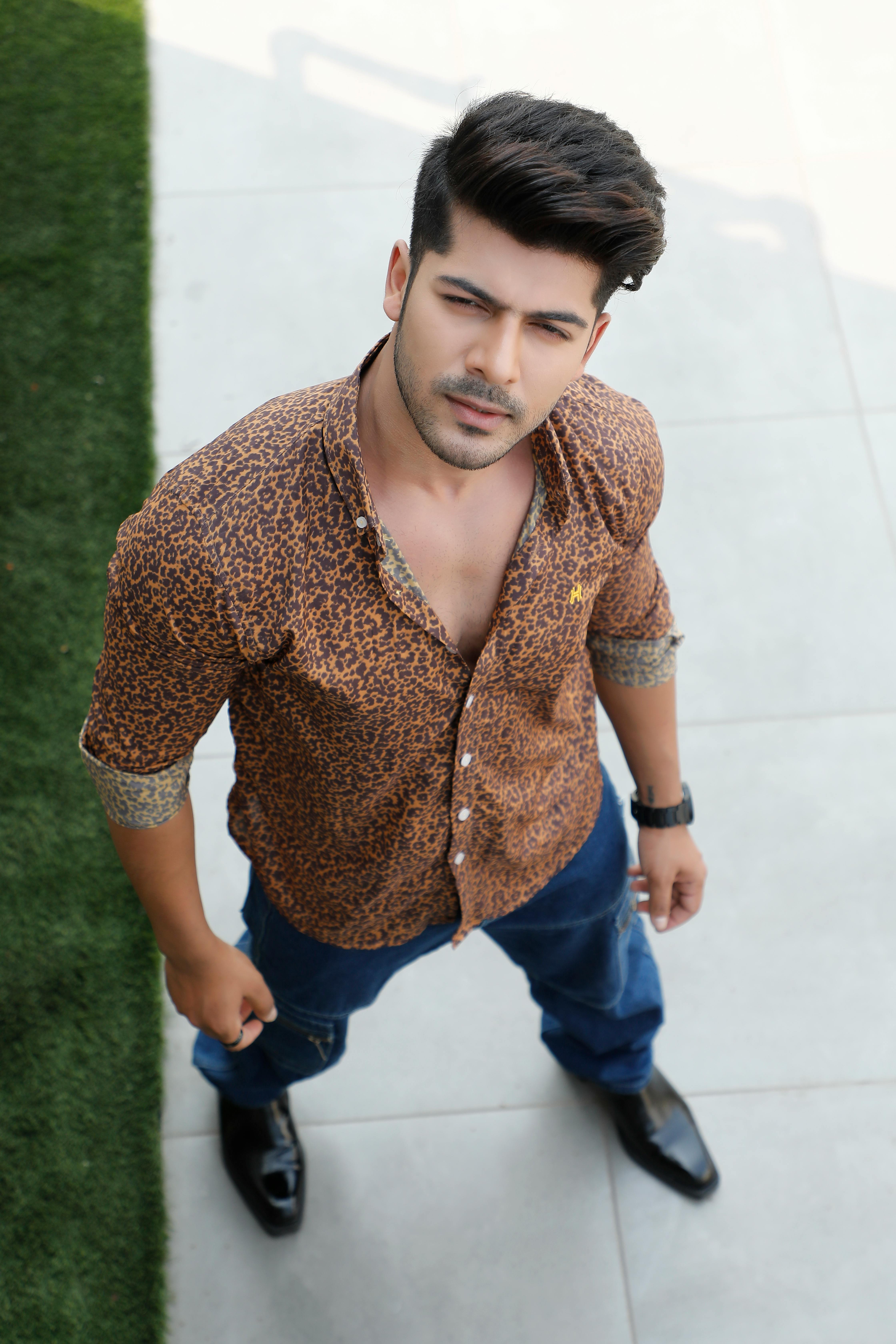 Young Man in a Leopard Print Shirt Free Stock Photo