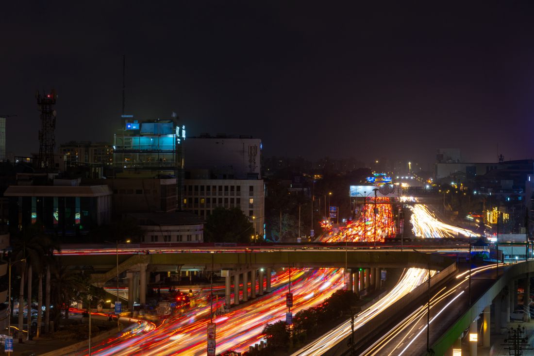 Light trails from traffic on a city street at night