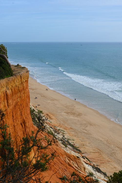 Free Breathtaking view of Algarve coastline in Portugal with cliffs and beach under a clear sky. Stock Photo