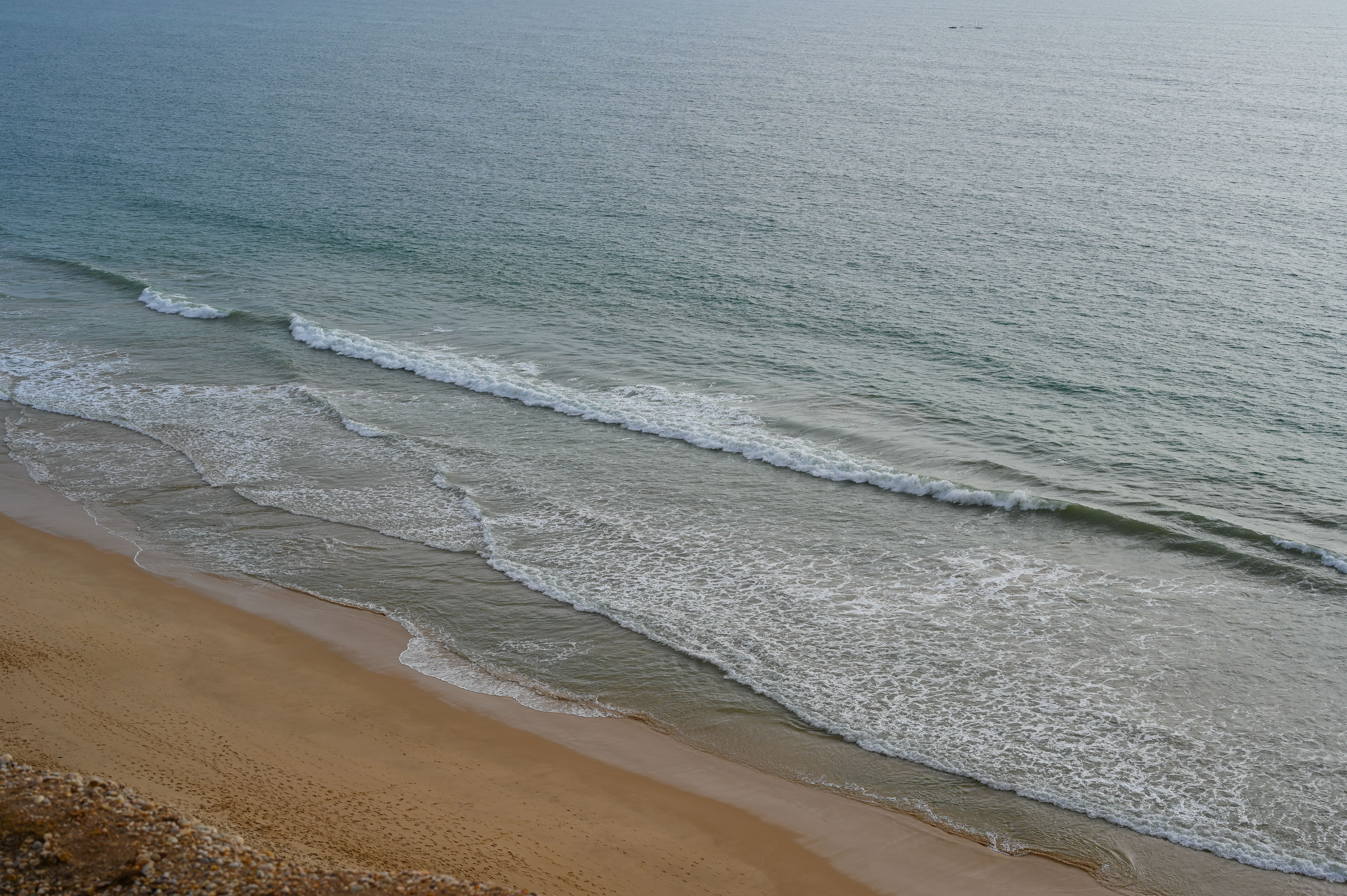 Sea Waves Brushing a Sandy Beach · Free Stock Photo