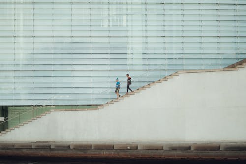 Two People Descending the Stairs