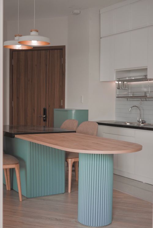 Free Sleek contemporary kitchen design featuring wooden accents and soft lighting. Stock Photo