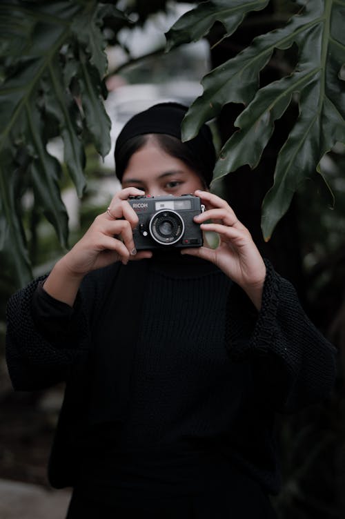 Woman Holding Analog Camera