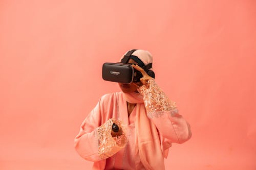 Model Using a VR Headset with a Wireless Controller and Headphones