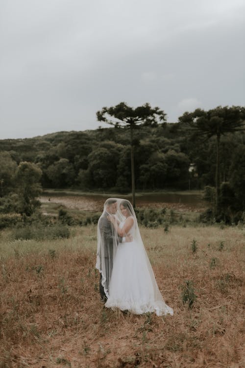 Newlywed Couple under Veil