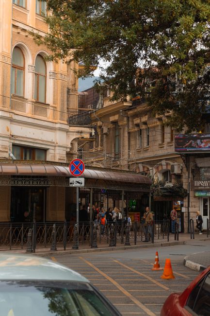 Charming street view showcasing historic urban architecture and active pedestrian life.