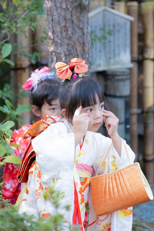 Free Two young girls in kimonos exploring outdoors, embracing cultural tradition. Stock Photo