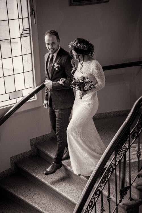 Bride and Groom Walking Down the Stairs 