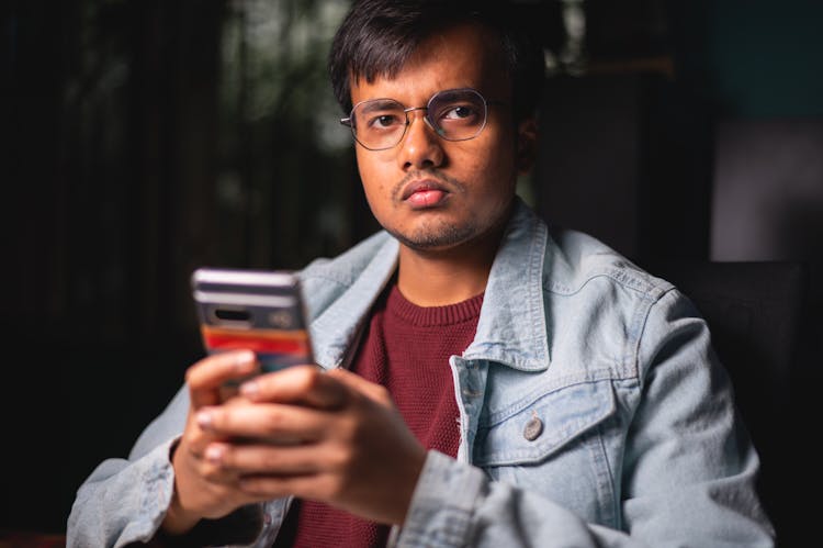 Portrait Of A Serious Man Wearing Eyeglasses