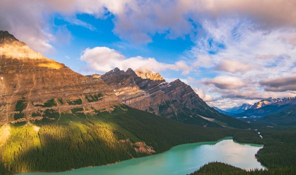 A breathtaking aerial view of Peyto Lake in Banff National Park with turquoise waters and rugged mountains.