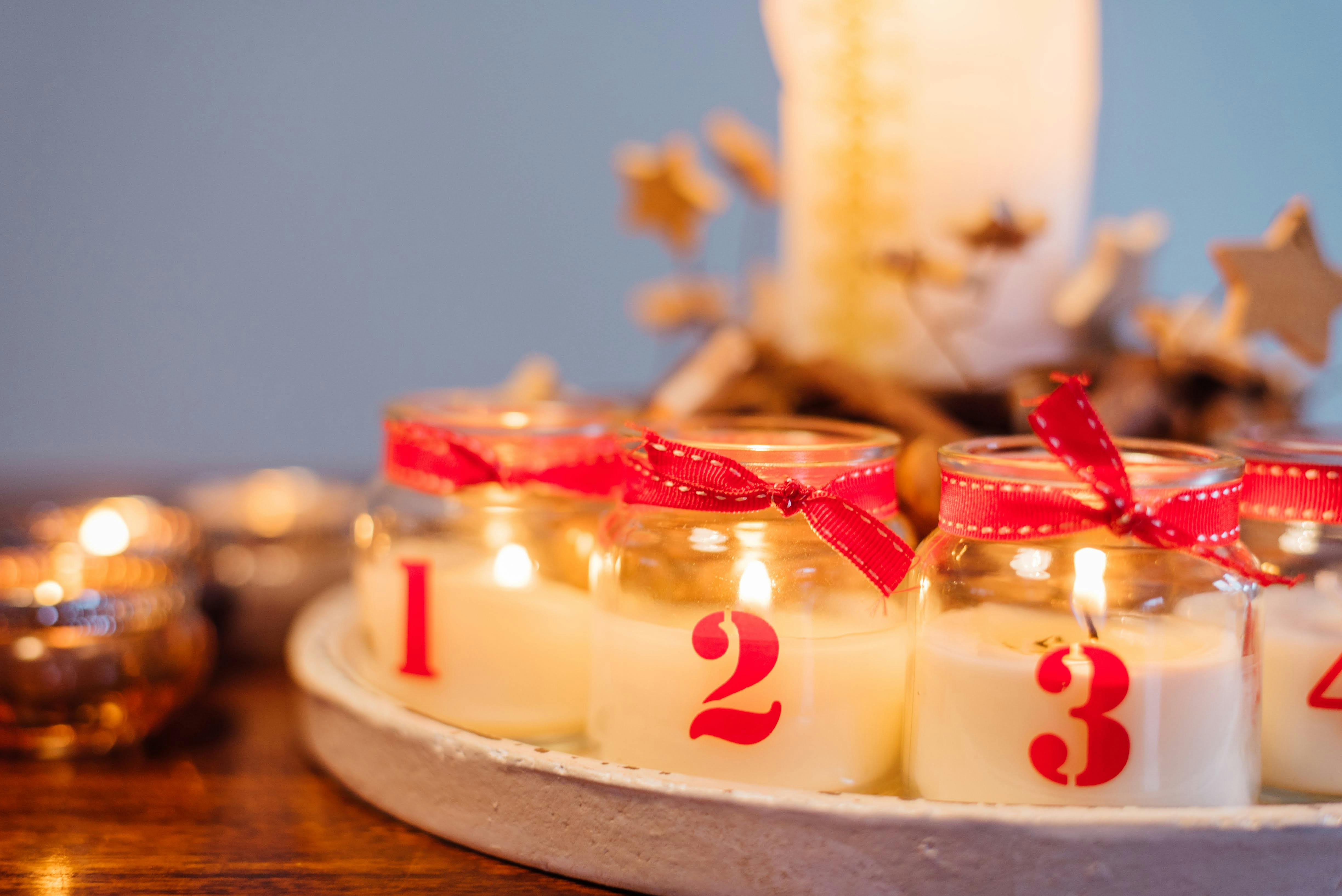 Numbered Candles in Glass Jars · Free Stock Photo