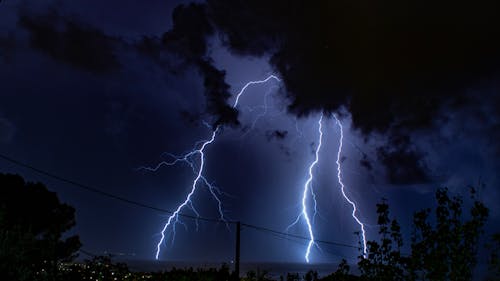 View of a Large Lightning Bolt at Night 