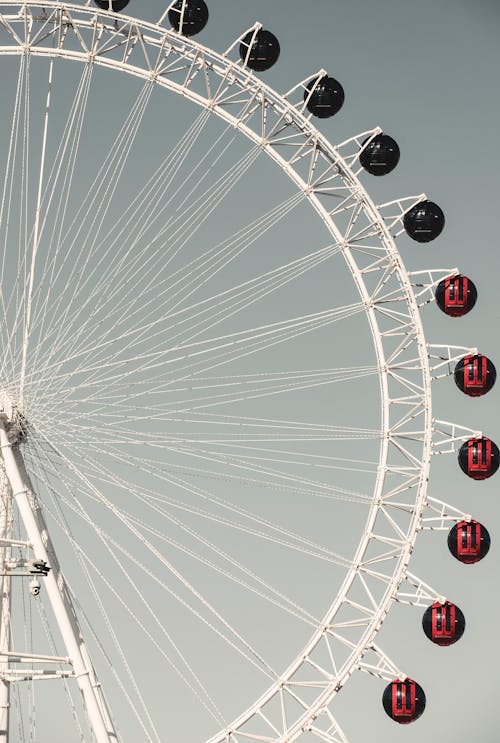 Red Cabins of Ferris Wheel against Clear Sky