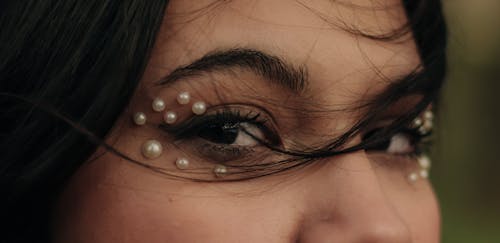 Close-up of Woamans Eyes Decorated with Makeup Pearls