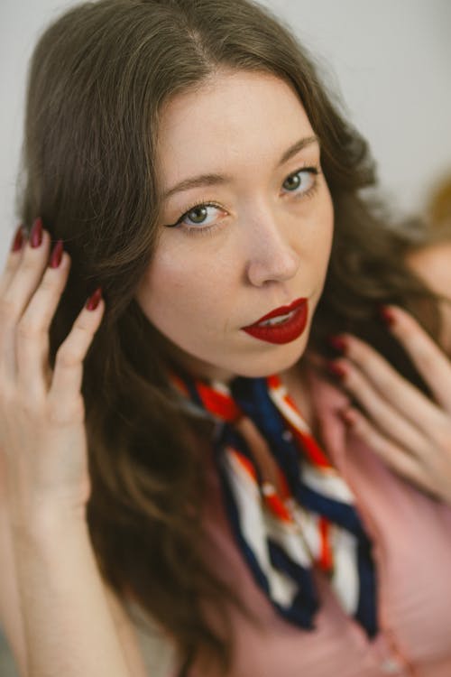 Portrait of a Pretty Brunette Wearing Red Lipstick