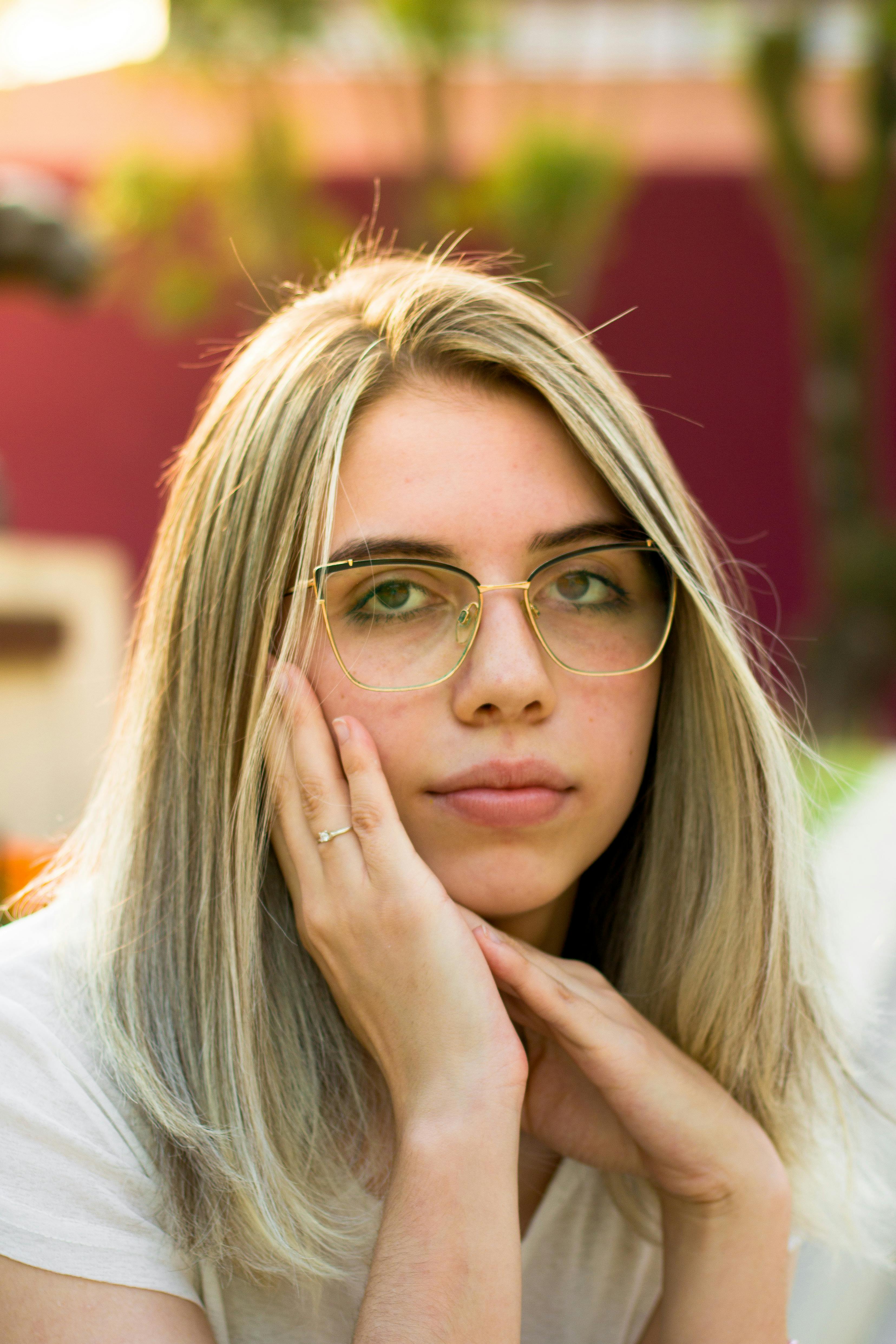 Portrait of Woman with Hand Raised · Free Stock Photo