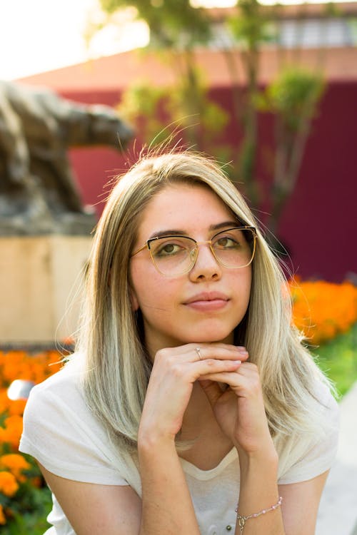 Blonde Woman with Hands under Chin