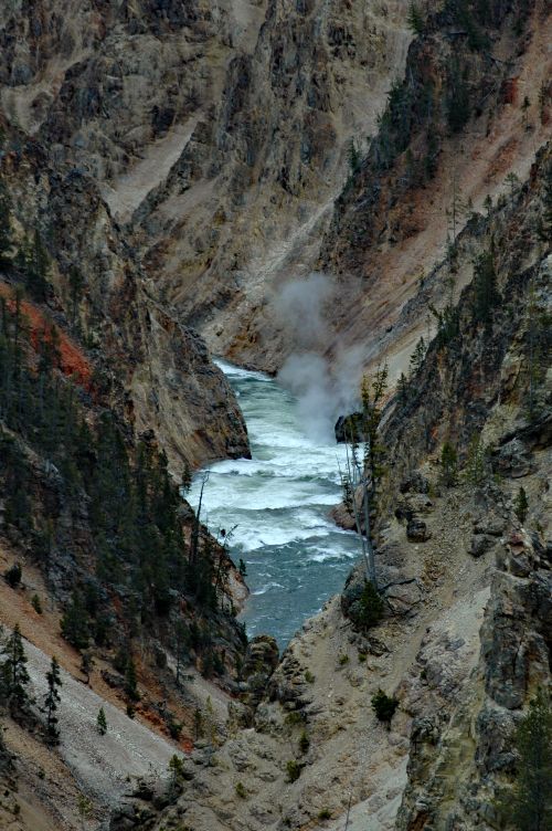 Free A breathtaking view of a river flowing through a dramatic rocky canyon, showcasing natural beauty. Stock Photo