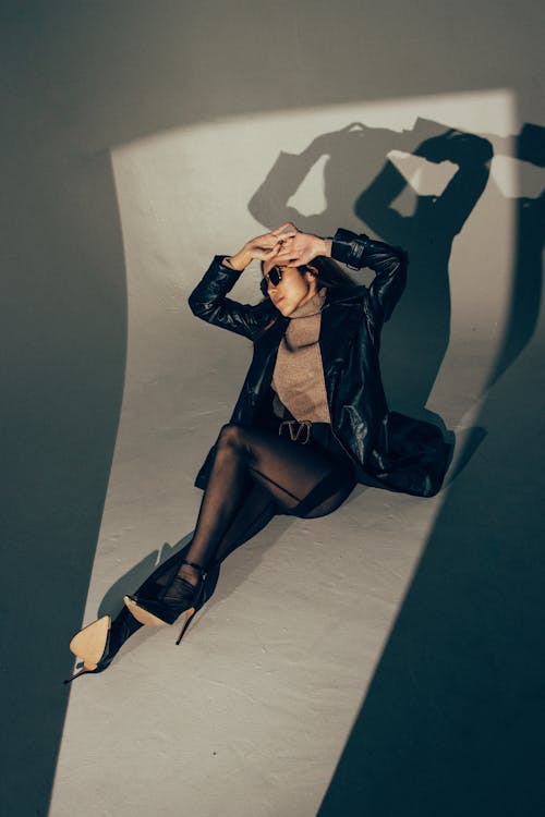 Model Posing in Black Jacket and Heels