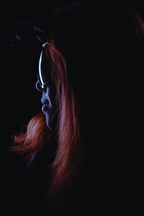 Abstract Photo of a Woman Wearing Goggles in the Dark