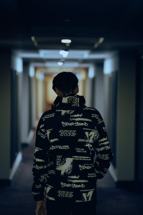 Man Wearing Jacket in a Hall 