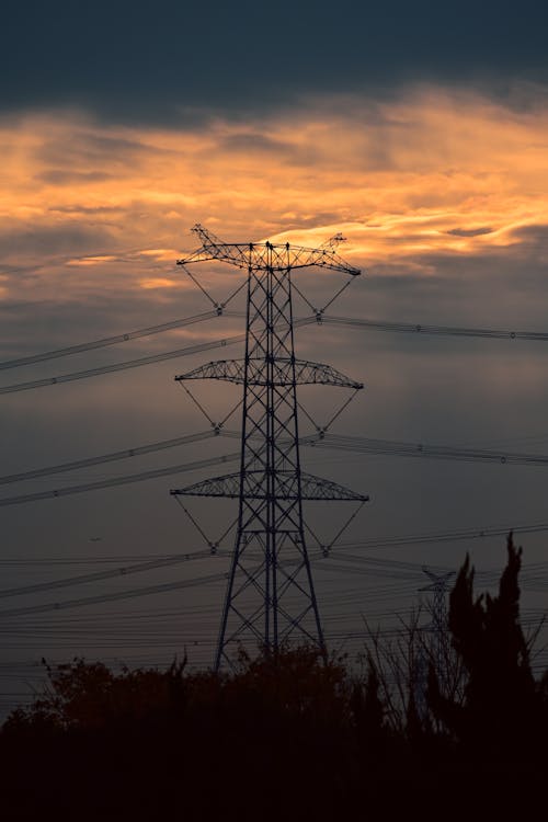 Silhouetted Electricity Pole and Lines at Sunset