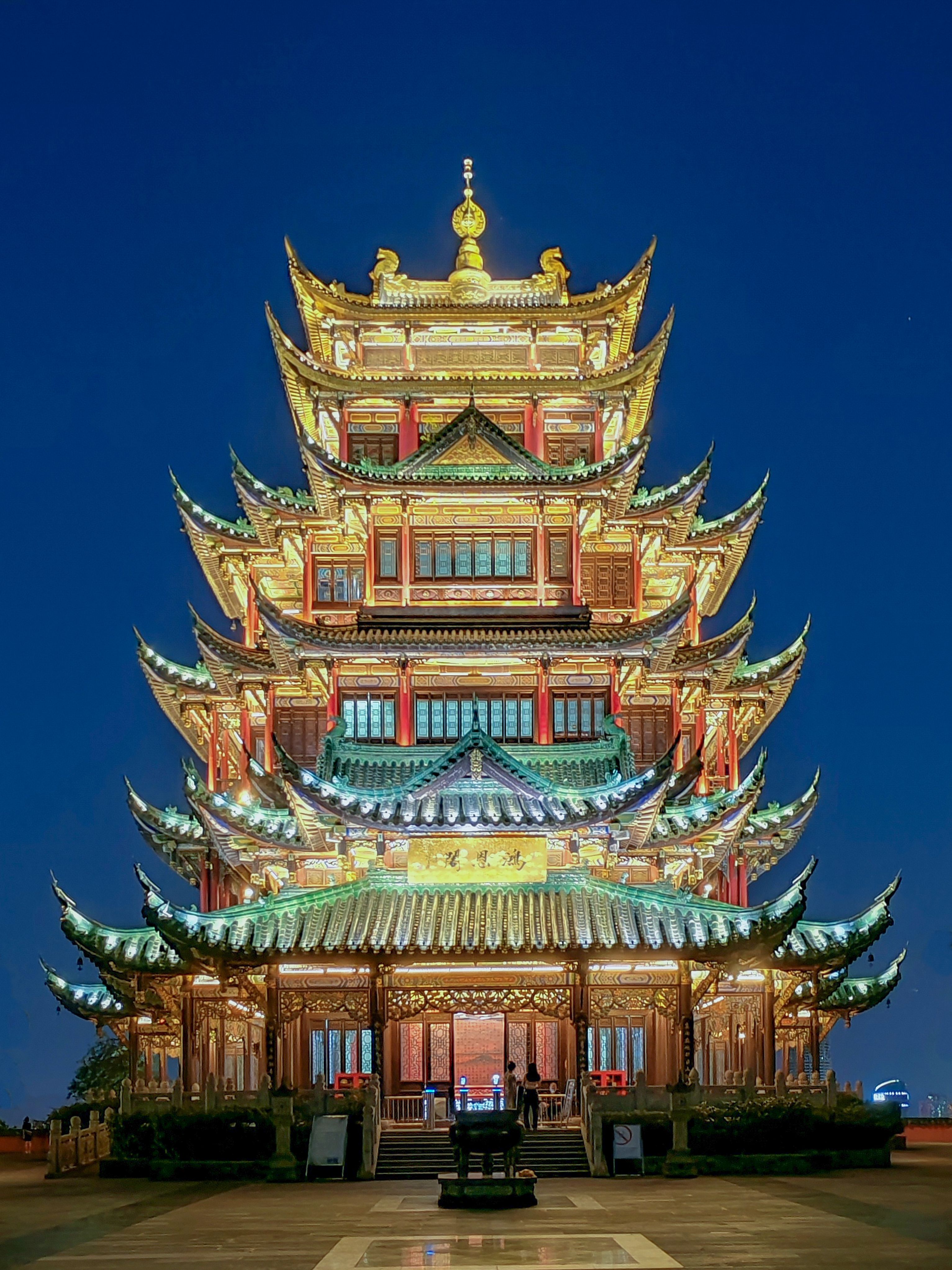 [ColoSach]-majestic-chinese-pagoda-lit-up-against-the-night-sky,-showcasing-intricate-traditional-architecture.